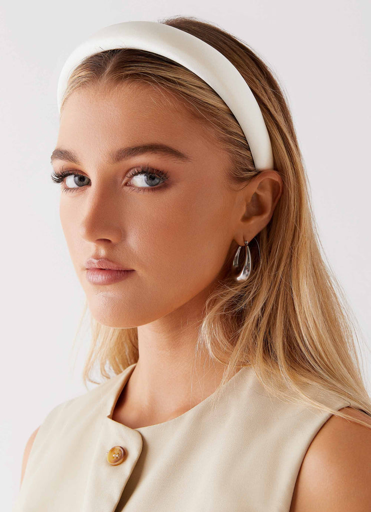 Womens Catch Me Headband in the colour Ivory in front of a light grey background