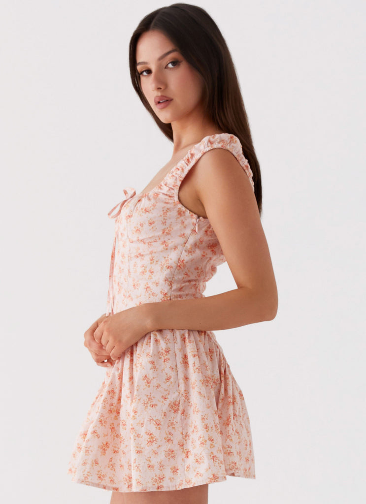 Womens Luna Ditsy Mini Dress in the colour Pink Ditsy Floral in front of a light grey background