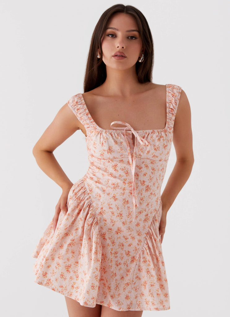Womens Luna Ditsy Mini Dress in the colour Pink Ditsy Floral in front of a light grey background