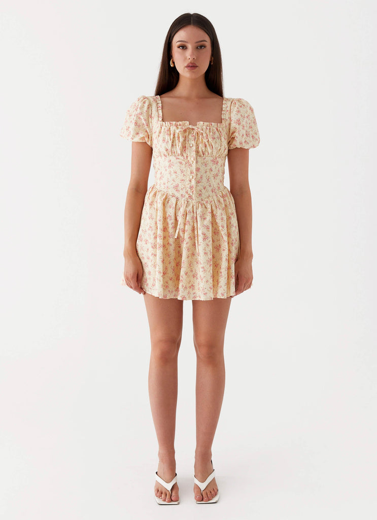Womens Mila Mini Dress in the colour Yellow Ditsy Floral in front of a light grey background