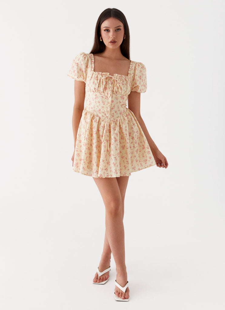 Womens Mila Mini Dress in the colour Yellow Ditsy Floral in front of a light grey background