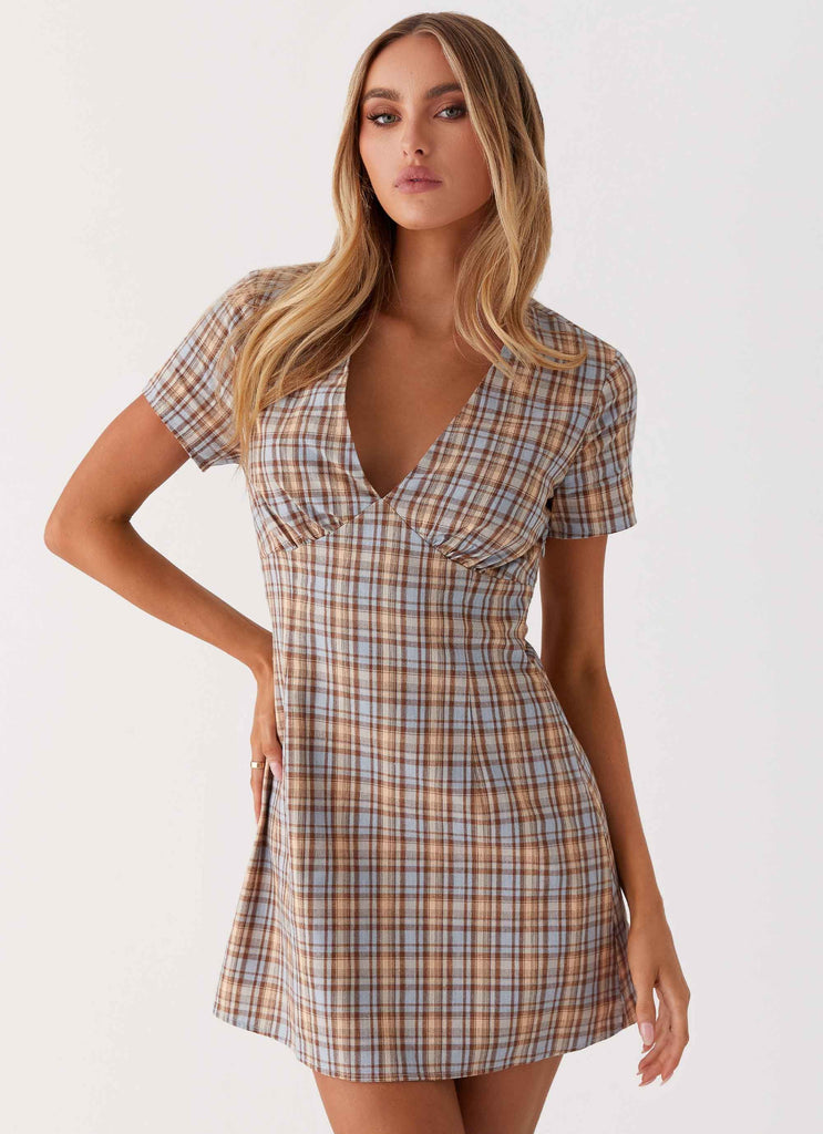 Womens Niki Cap Sleeve Mini Dress in the colour Check in front of a light grey background