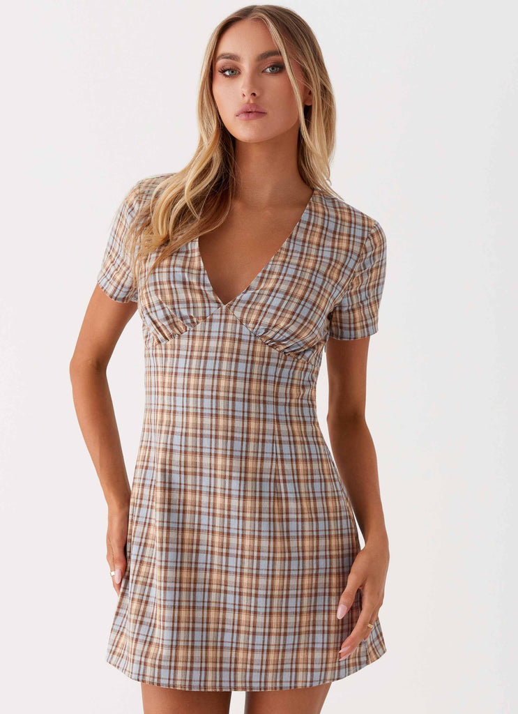 Womens Niki Cap Sleeve Mini Dress in the colour Check in front of a light grey background