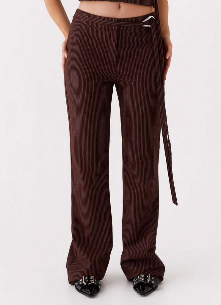 Womens Orla Fitted Flare Pants in the colour Chocolate in front of a light grey background