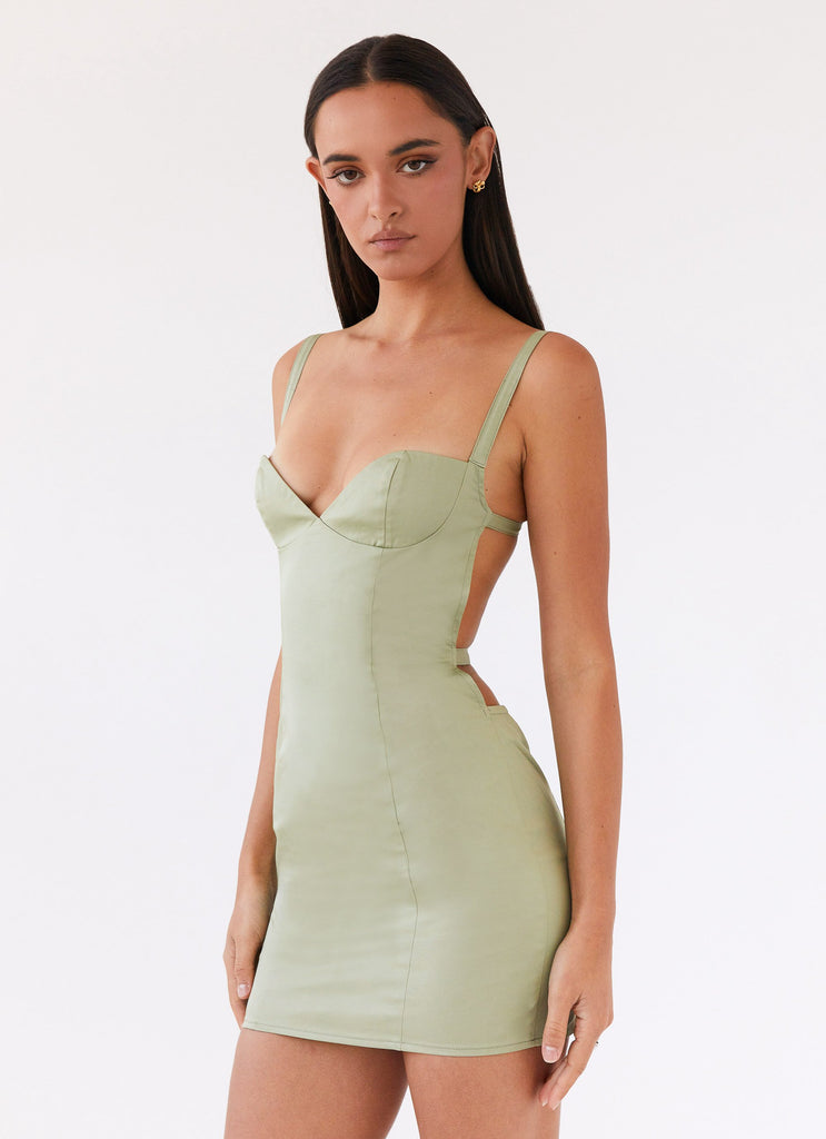 Womens Naomi Backless Mini Dress in the colour Sage in front of a light grey background