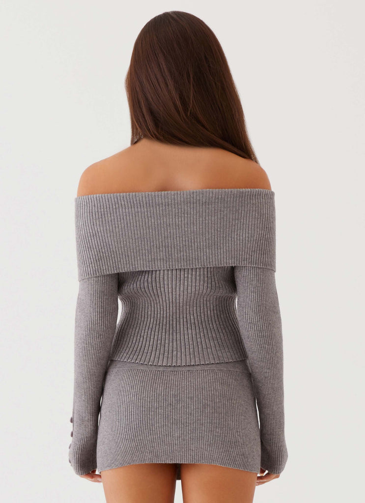 Womens Frankie Arrow Knit Long Sleeve Top in the colour Charcoal in front of a light grey background