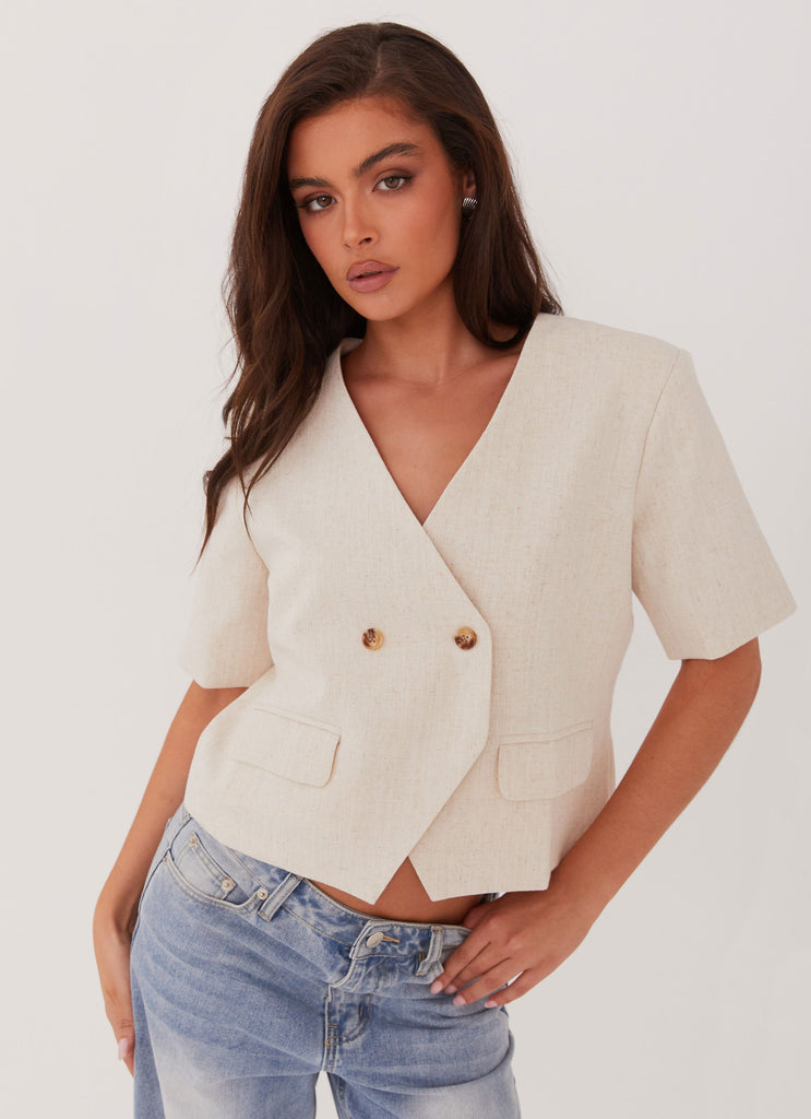 Womens Hacienda Linen Short Sleeve Blazer in the colour Oatmeal in front of a light grey background