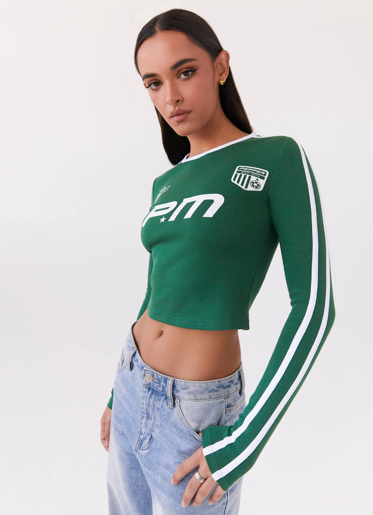 Womens Touch Base Long Sleeve Top in the colour Pine Green in front of a light grey background