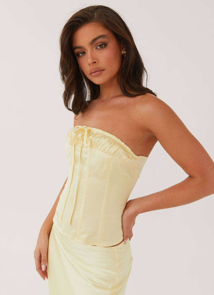 Womens Golden Grace Bustier Top in the colour Lemon in front of a light grey background