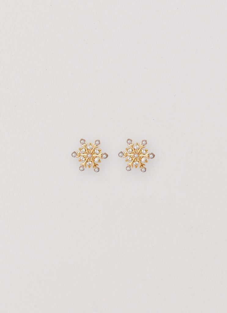 Womens Crystal Snowflake Earring in the colour Gold in front of a light grey background