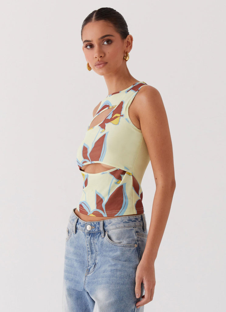 Womens Beyond Cut Out Mesh Top in the colour Primrose in front of a light grey background