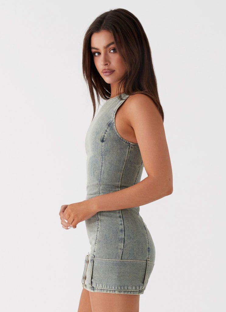 Womens Dark Matter Mini Dress in the colour Washed Denim in front of a light grey background