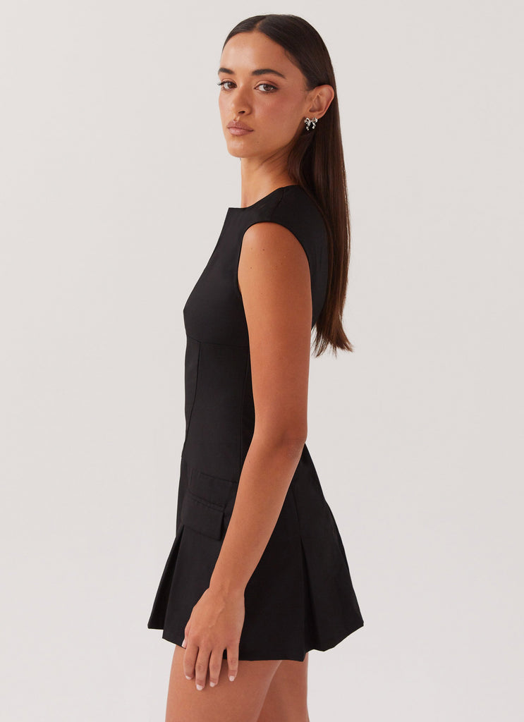 Womens Cassia Mini Dress in the colour Black in front of a light grey background