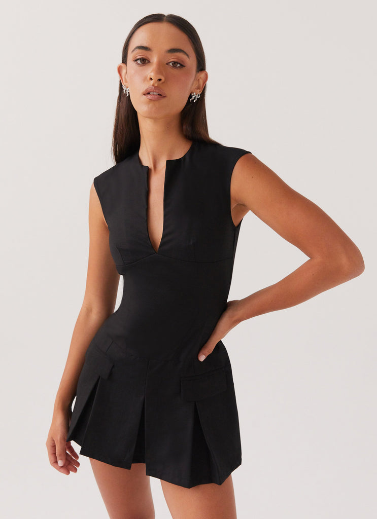 Womens Cassia Mini Dress in the colour Black in front of a light grey background