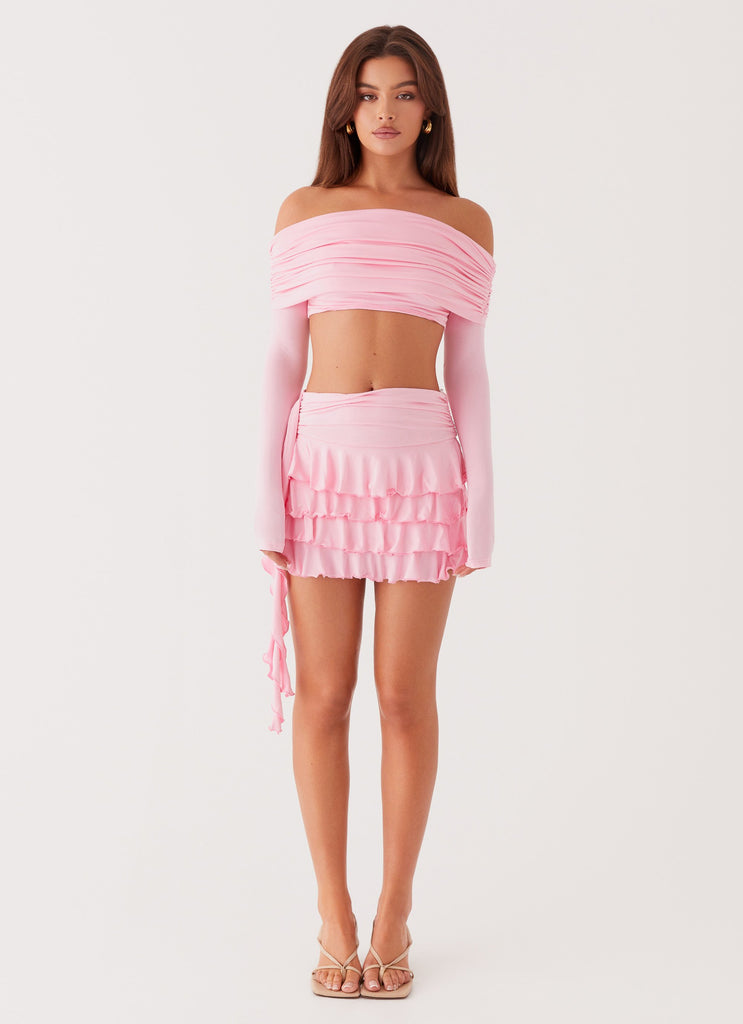 Womens Bardot Long Sleeve Crop Top in the colour Candy Pink in front of a light grey background