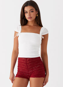 Womens Desert Isle Mini Shorts in the colour Red in front of a light grey background