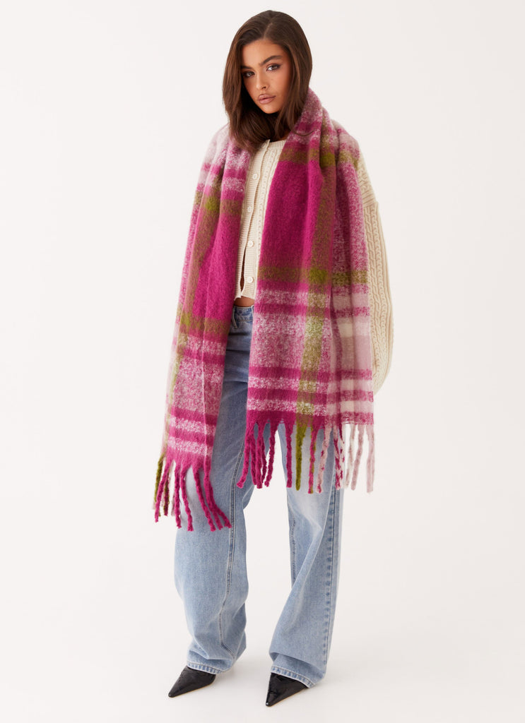 Womens Rainier Plaid Scarf in the colour Pink in front of a light grey background