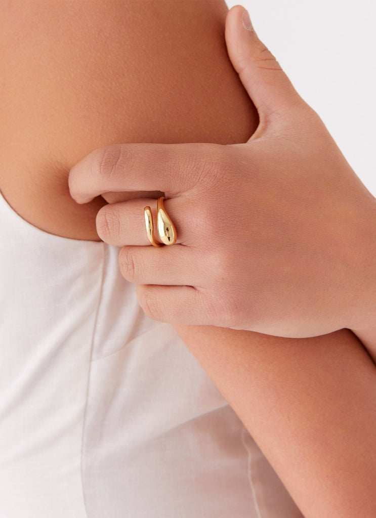 Womens Teardrop Wrap Ring in the colour Gold in front of a light grey background