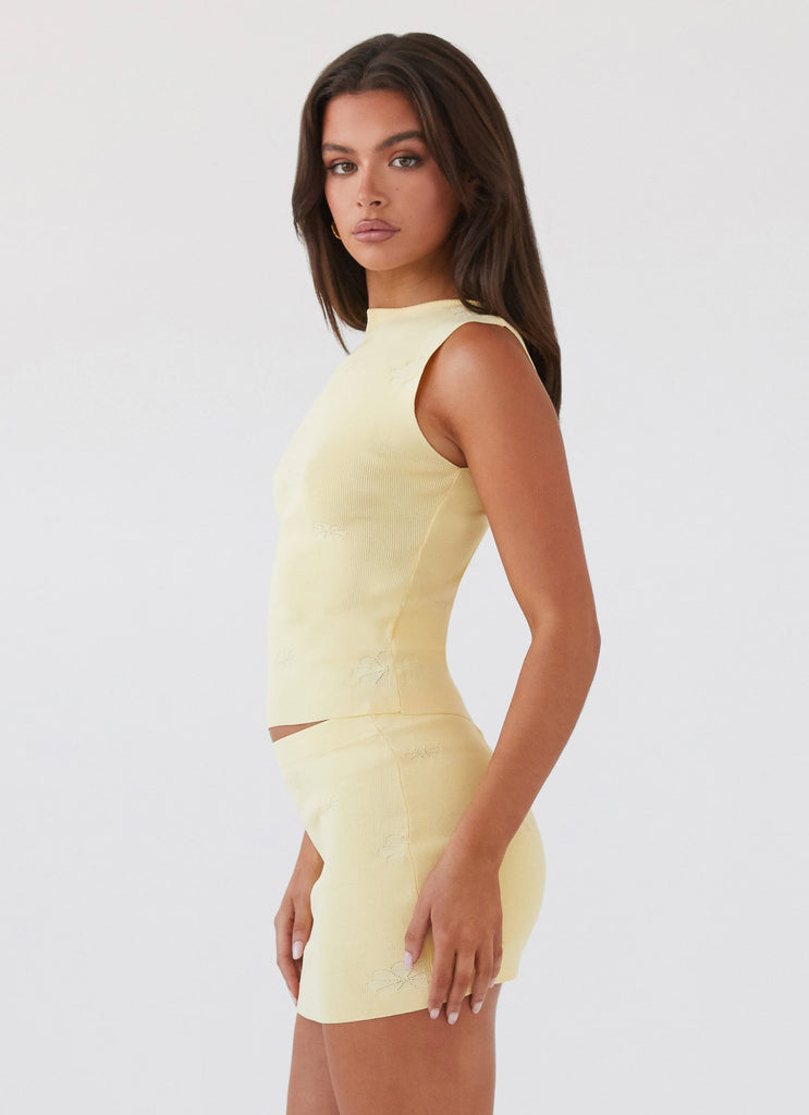 Womens Holly Knit Tank in the colour Lemon in front of a light grey background