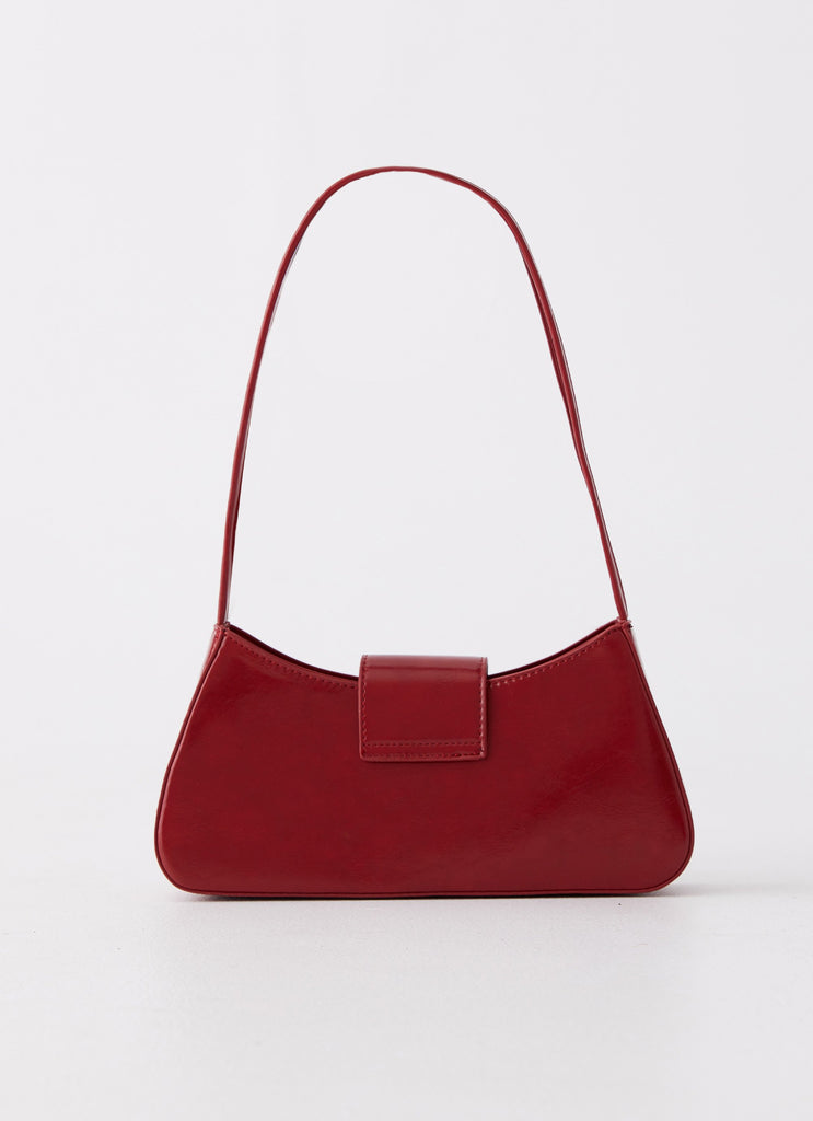 Womens Cara Bow Shoulder Bag in the colour Red in front of a light grey background