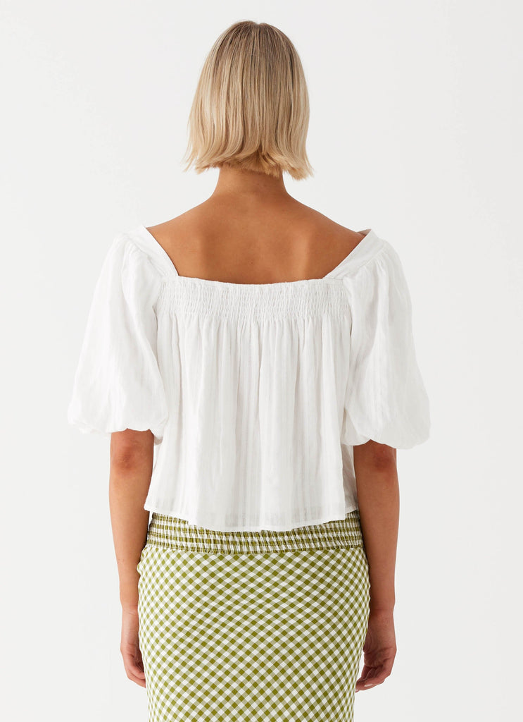 Womens Tanika Puff Sleeve Top in the colour White in front of a light grey background