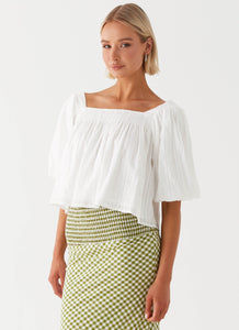 Womens Tanika Puff Sleeve Top in the colour White in front of a light grey background