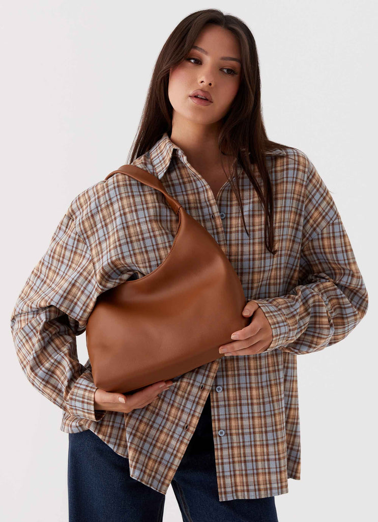 Womens Whitney Shoulder Bag in the colour Brown in front of a light grey background