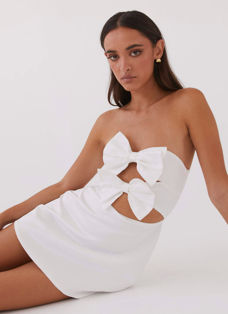 Womens Girl Crush Bow Mini Dress in the colour White in front of a light grey background