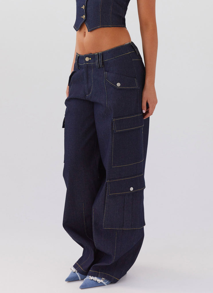 Womens Greedy Denim Cargo Pants in the colour Indigo in front of a light grey background