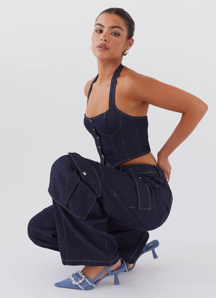 Womens Greedy Denim Cargo Pants in the colour Indigo in front of a light grey background