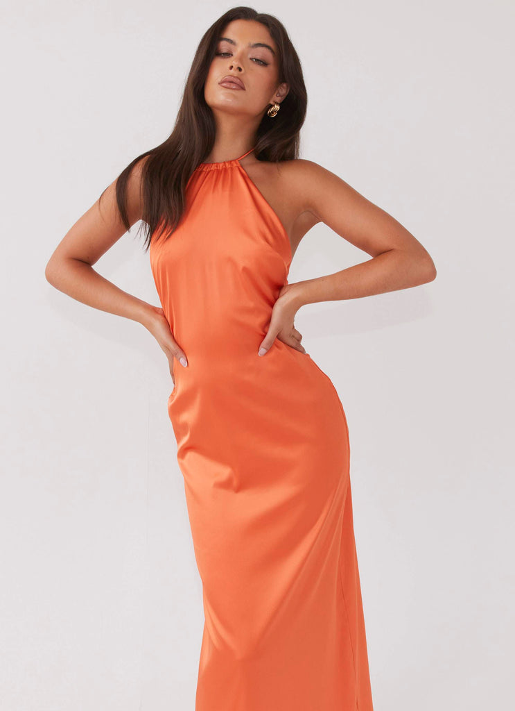 Womens Melody Day Halterneck Maxi Dress in the colour Tangerine in front of a light grey background