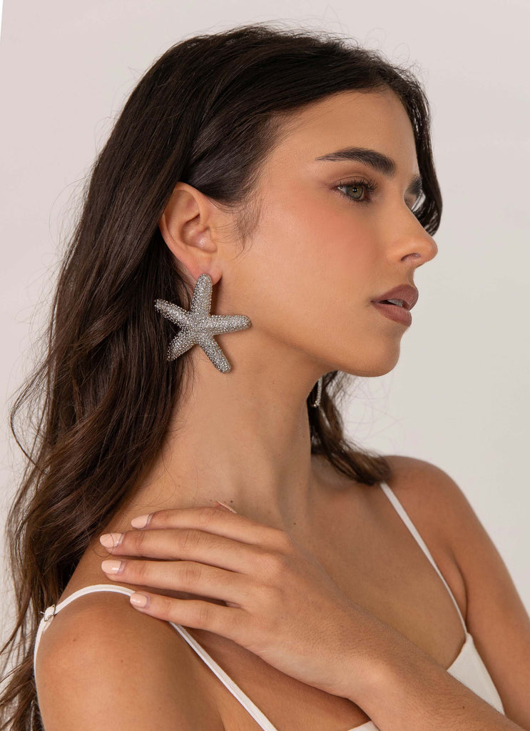 Womens Geneve Starfish Earring in the colour Silver in front of a light grey background