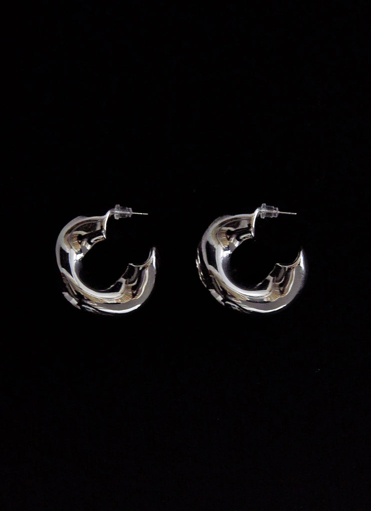 Womens Jovie Hoop Earrings in the colour Silver in front of a light grey background