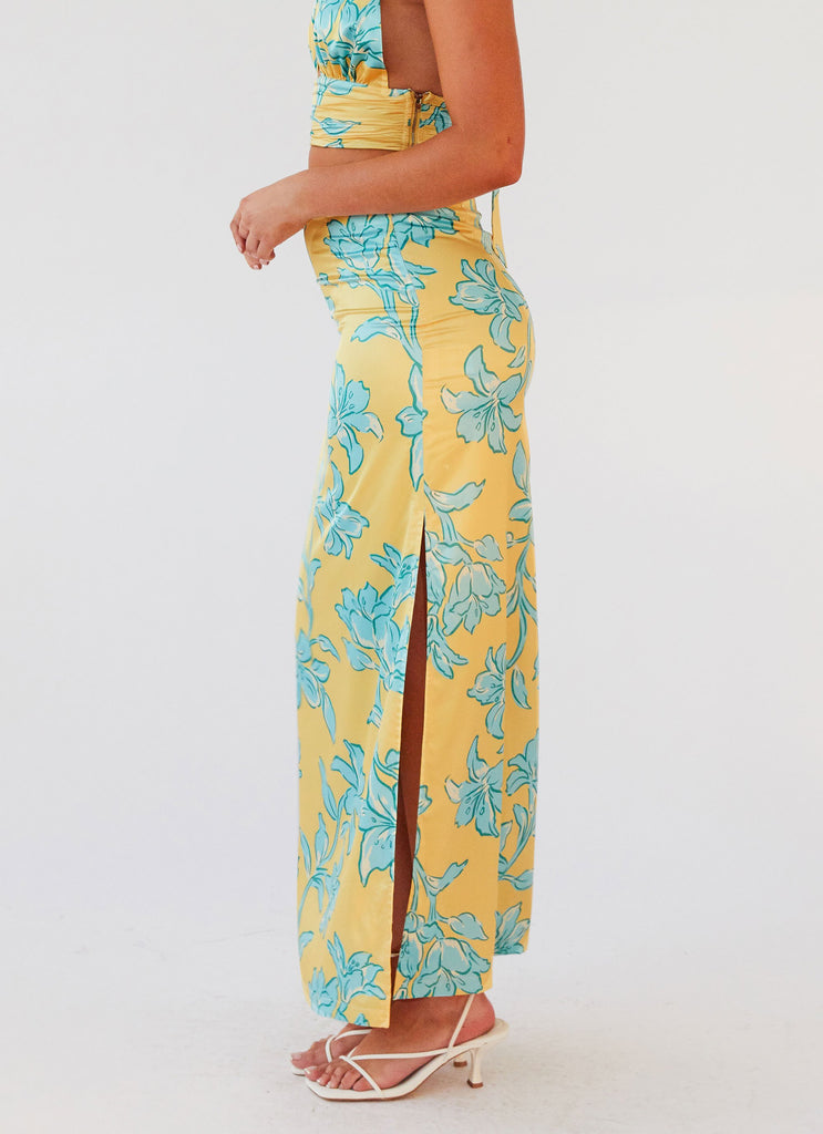 Womens Amalia Satin Maxi Skirt in the colour Golden Bloom in front of a light grey background