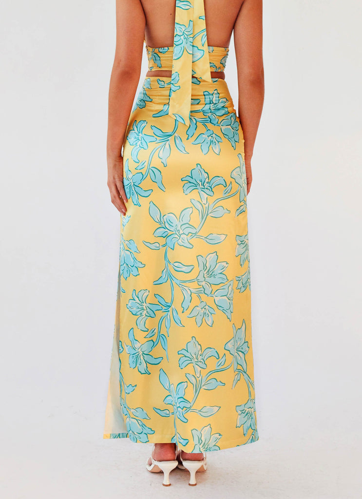 Womens Amalia Satin Maxi Skirt in the colour Golden Bloom in front of a light grey background