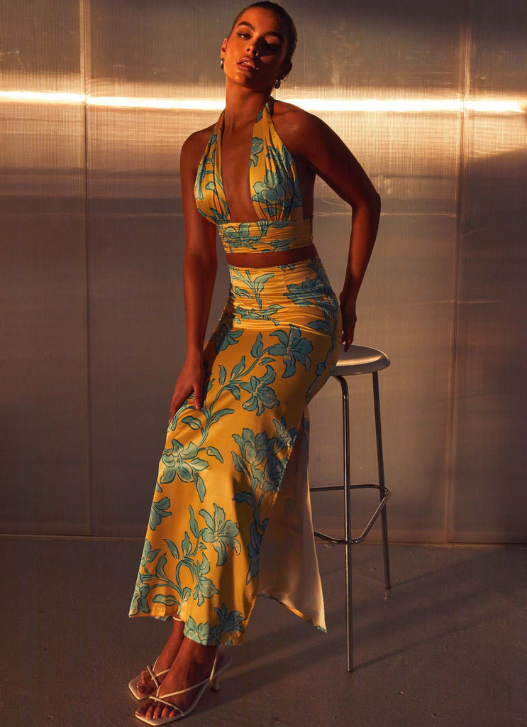 Womens Amalia Satin Maxi Skirt in the colour Golden Bloom in front of a light grey background