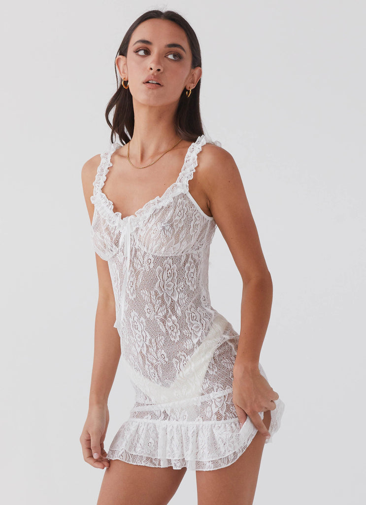 Womens Love Lies Lace Mini Dress in the colour Snow in front of a light grey background