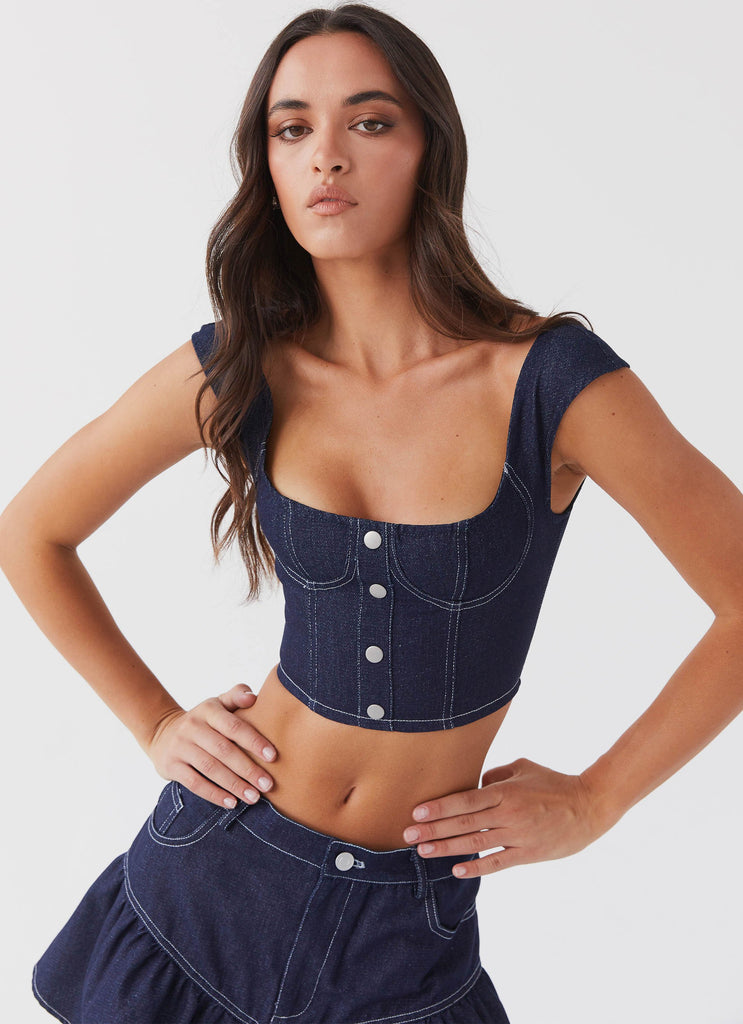 Womens Isabella Denim Bustier Top in the colour Indigo in front of a light grey background